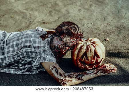 Halloween Man Lying With Pumpkin