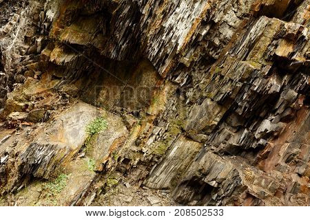 Diagonal rock material texture. Macro of old mountain stones pattern background.
