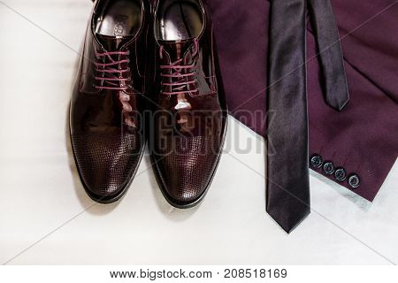 Shoes Are A Jacket And A Tie. Wedding Accessories Of The Bride In The Maroon Style