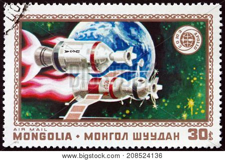 MONGOLIA - CIRCA 1975: a stamp printed in Mongolia shows Apollo Soyuz and Earth Apollo Soyuz Space Test Project Space Cooperation circa 1975