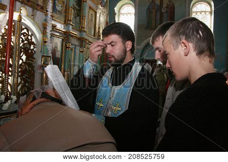 Voyutyn Ukraine - 14 October 2008: Priest And Ukrainian Parishioners Of The Orthodox Church During T