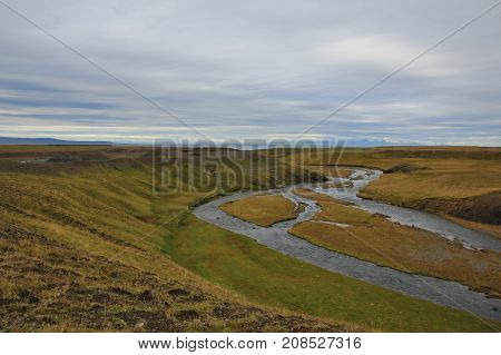 Landscape in Northurland Iceland. River and green meadow.