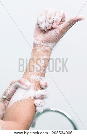 Nurse perform surgical hand washing Preparation to the operating room. Closed-up of the hands.
