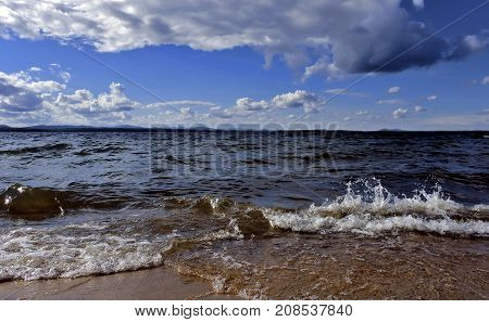 Noisy Wave Is Incident On The Shore Of The Lake
