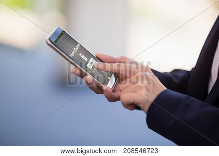 Payment declined text on mobile display against businesswoman using mobile phone