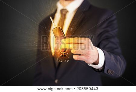 Formal man hand over shiny keys with dark background