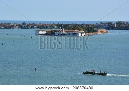 The view from the top of the bellltower of San Giorgio Maggiore church in Venice showing the island of San Servolo formerly a convent and then a psychiatric institution now a university building