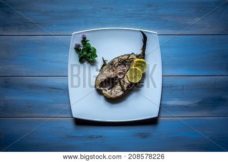 Grilled yellowtail amberjack just cooked fillets with lemon slices.
