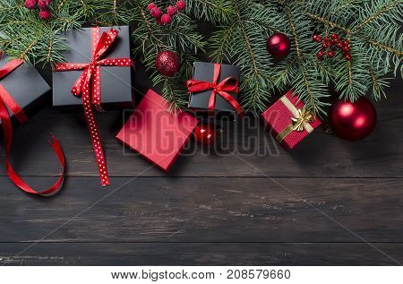 Black And Red  Christmas  Gift  Box With Red Ribbon And Fir Branches