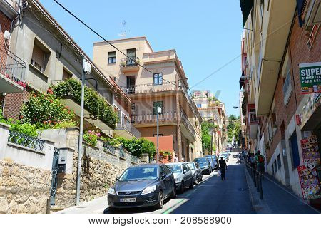 BARCELONA - JUN. 10, 2013: Baixada de la Glòria is a mountain road to Park Güell in  the Gràcia district of Barcelona, Catalonia, Spain.