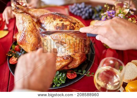 Tasty baked chicken on vegetables pillow. Ready for holidays table. Close-up of delishious chicken with vegetables. Food concept.
