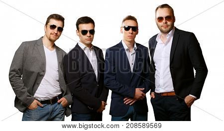 Group of male friends isolated on white background. Friendly team, harsh guys in sunglasses and suits. Angry guards or business colleagues.