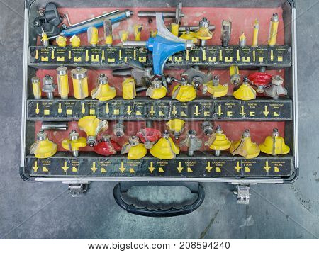 A set of different yellow tips for drilling or hooking holes in a box