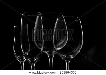 Glassware Selection With Wine, Champagne And Liquour Glasses  On The Dark Background
