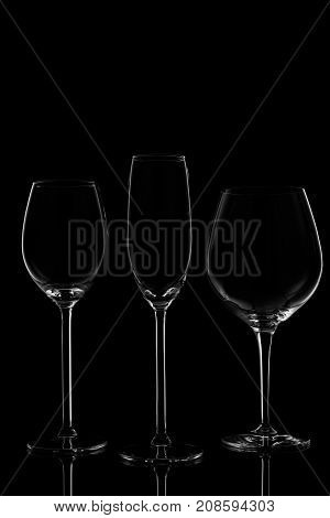 Glassware Selection With Wine, Champagne And Liquour Glasses  On The Dark Background