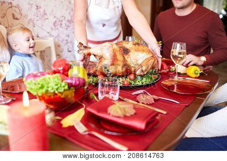 Tasty baked chicken on vegetables pillow. Ready for holidays table. Close-up of holiday table. Food concept.