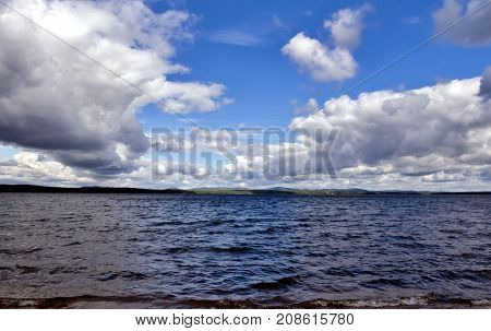 Bright Clouds Reflected In The Water