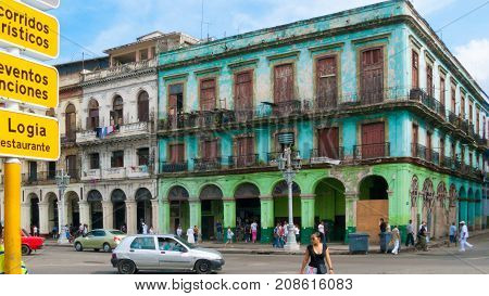 February 2012 Havana - During this time of year tourists walk along the streets of Paseo Marti to appreciate its buildings with old facades
