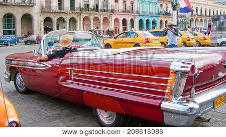 February 2012 Havana - During this time of year these beautifully restored vintage cars bring tourists to visit the streets of the Havana center driven exclusively by their jealous owners