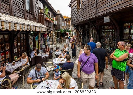 NESEBAR BULGARIA - AUGUST 21 2017: Tourists in the old town. Nesebar is an ancient city and one of the major seaside resorts on the Bulgarian Black Sea Coast.