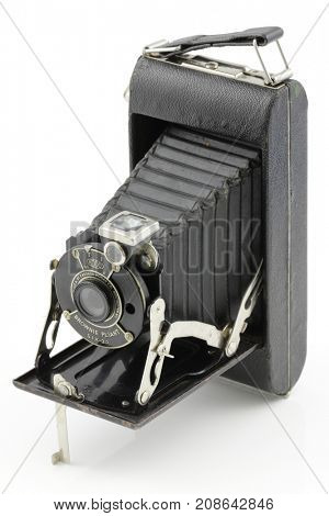 KRAKOW, POLAND - OCTOBER 9, 2017. Eastman Kodak Brownie Pliant Six-20 Vintage camera close up in studio isolated on white background.