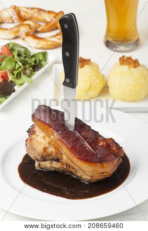 frankonian schaeufele roasted pork portion with beer