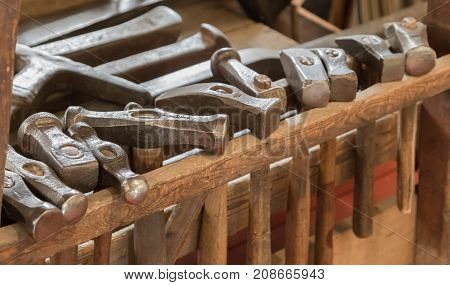Collection Of Vintage Woodworking Tools On A Rough Workbench