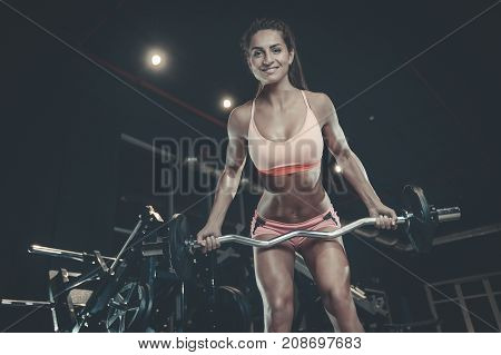Sexy Athletic Young Girl Training Back In Gym