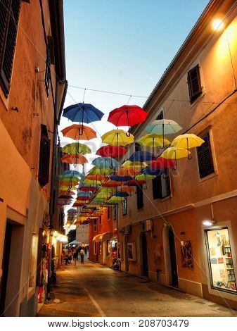 Rainbow umbrellas in a hot summer evening.