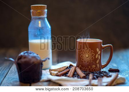 a carafe of milk chocolate cappuccino cupcake and cinnamon