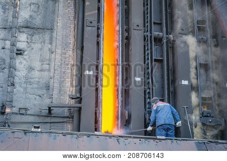Coke Furnace. Production Of Coke. Steel Works. The Person Loads Coke In The Furnace. The Heated Coal