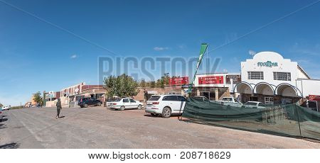 GROBLERSHOOP SOUTH AFRICA - JUNE 11 2017: A street scene with businesses and vehicles of Groblershoop a town in the Northern Cape Province of South Africa