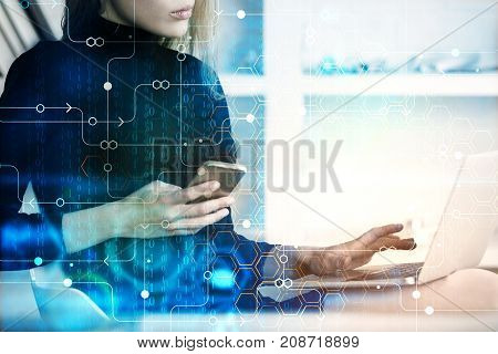 Young european businesswoman using cellphone and laptop with abstract circuit pattern. Technology concept. Double exposure