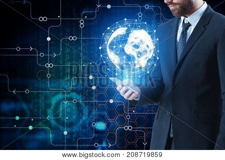 Young businessman using smartphone with digital globe on abstract background with digital circuit. Communication concept. Double exposure