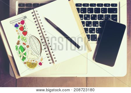 Top view of creative office table with empty smartphone laptop keyboard spiral notepad with creative sketch and other items. Mock up 3D Rendering