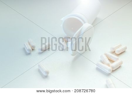 White Pills Capsules Spillage