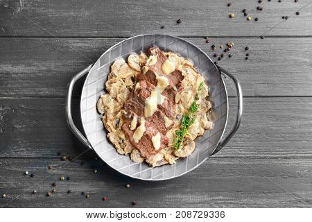 Dish with steak Diane on table