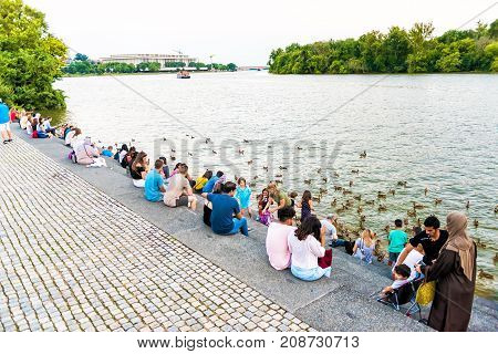 Washington Dc, Usa - August 4, 2017: People Sitting On Steps In Georgetown Waterfront Park On Riverf