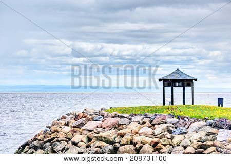 Field Of Yellow Dandelion Flowers And Gazebo By Saint Lawrence River In La Malbaie, Quebec, Canada I