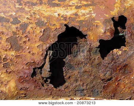 rusty  metal orange hole