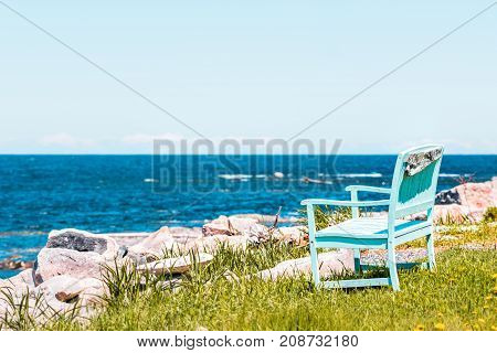 One Peaceful Blue Aquamarine Turquoise Green Beach Chair Empty Bench In Front Of Ocean