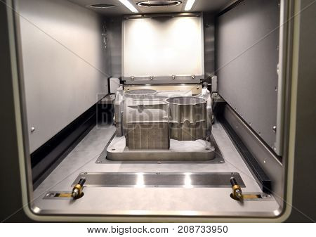 A model with supports created in a laser sintering machine stays in the working chamber. DMLS SLM SLS technology. Concept of 4.0 industrial revolution. Progressive modern additive technology.