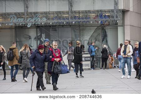 Square in front of the shopping centre Cracow Poland - October 13 2017: People are walking around entry of Galeria Krakowska shopping centre Cracow Poland.