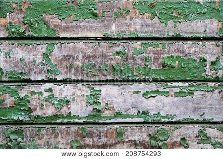 Old small wooden boards with peeling paint