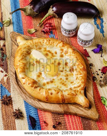 Ajarian Khachapuri traditional Georgian cheese pastry on plate 