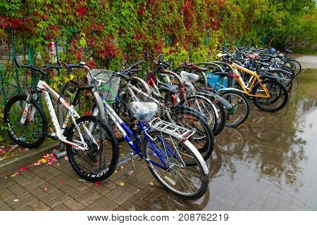 Zelenograd, Russia - September 15. 2017. bicycle parking at Kryukovo station in the fall in a puddle