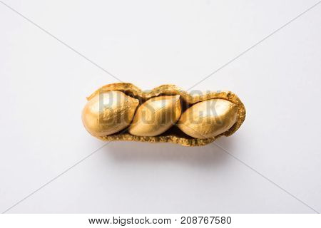 Concept of individuality, luck,value,exclusivity and better choice. Golden peanut or ground nut, standing out amongst normal peanuts, over black or white background
Concept of individuality, luck,value,exclusivity and better choice. Golden peanut or groun