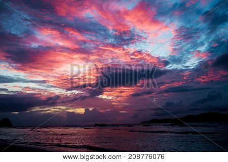 Sunset seascape with dramatic sky and colorful clouds