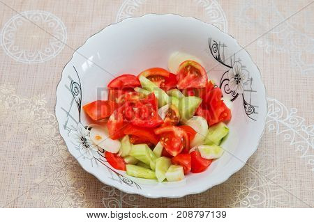 Tomato cucumber salad inside the trough Azerbaijani salad from Baku