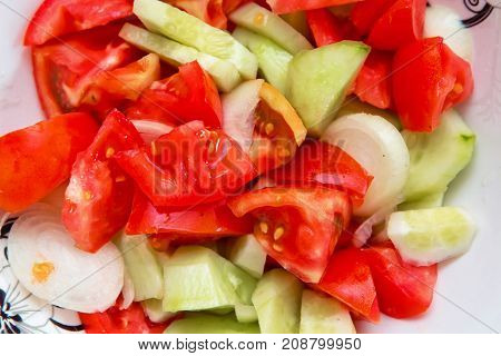 Tomato cucumber salad inside the trough Azerbaijani salad